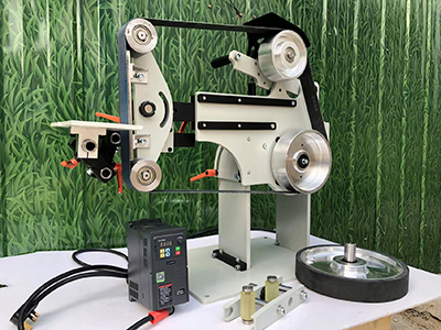 What is the main purpose of a belt grinder?